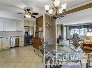 65 Tower Road Edison, NJ 08820 - Photo 2 of 14 a view of a livingroom with furniture and a chandelier