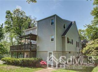 65 Tower Road Edison, NJ 08820 - Photo 4 of 14 a front view of a house with a garden