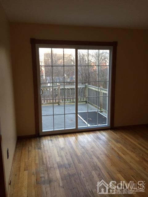 65 Tower Road Edison, NJ 08820 - Photo 6 of 14 a view of wooden floor and windows in a room