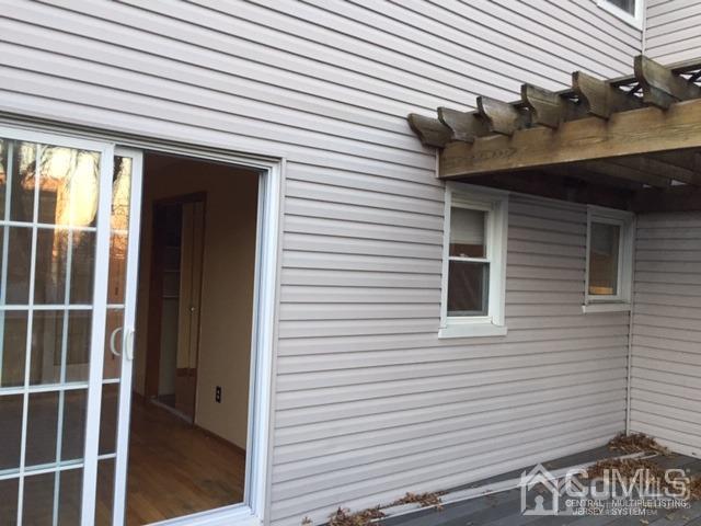65 Tower Road Edison, NJ 08820 - Photo 10 of 14 a view of wooden house and a large window