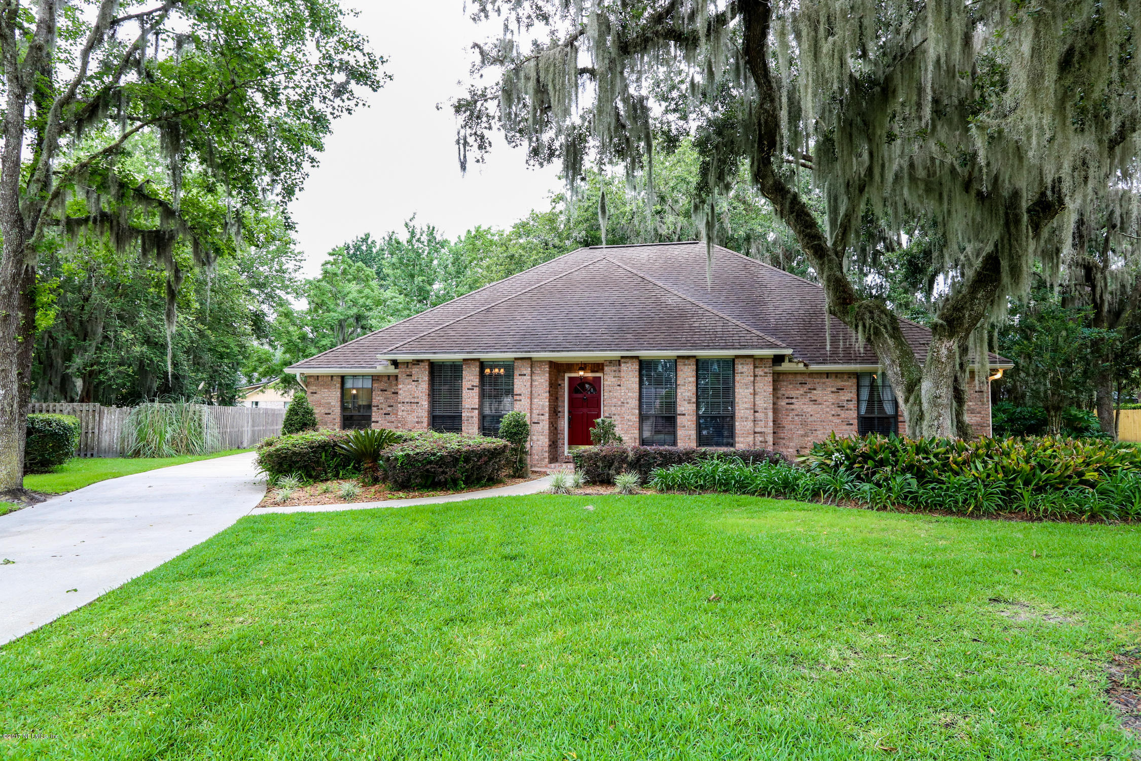 3141 Nautilus Road Middleburg, FL 32068 - Photo 1 of 43 a view of house with garden and a tree