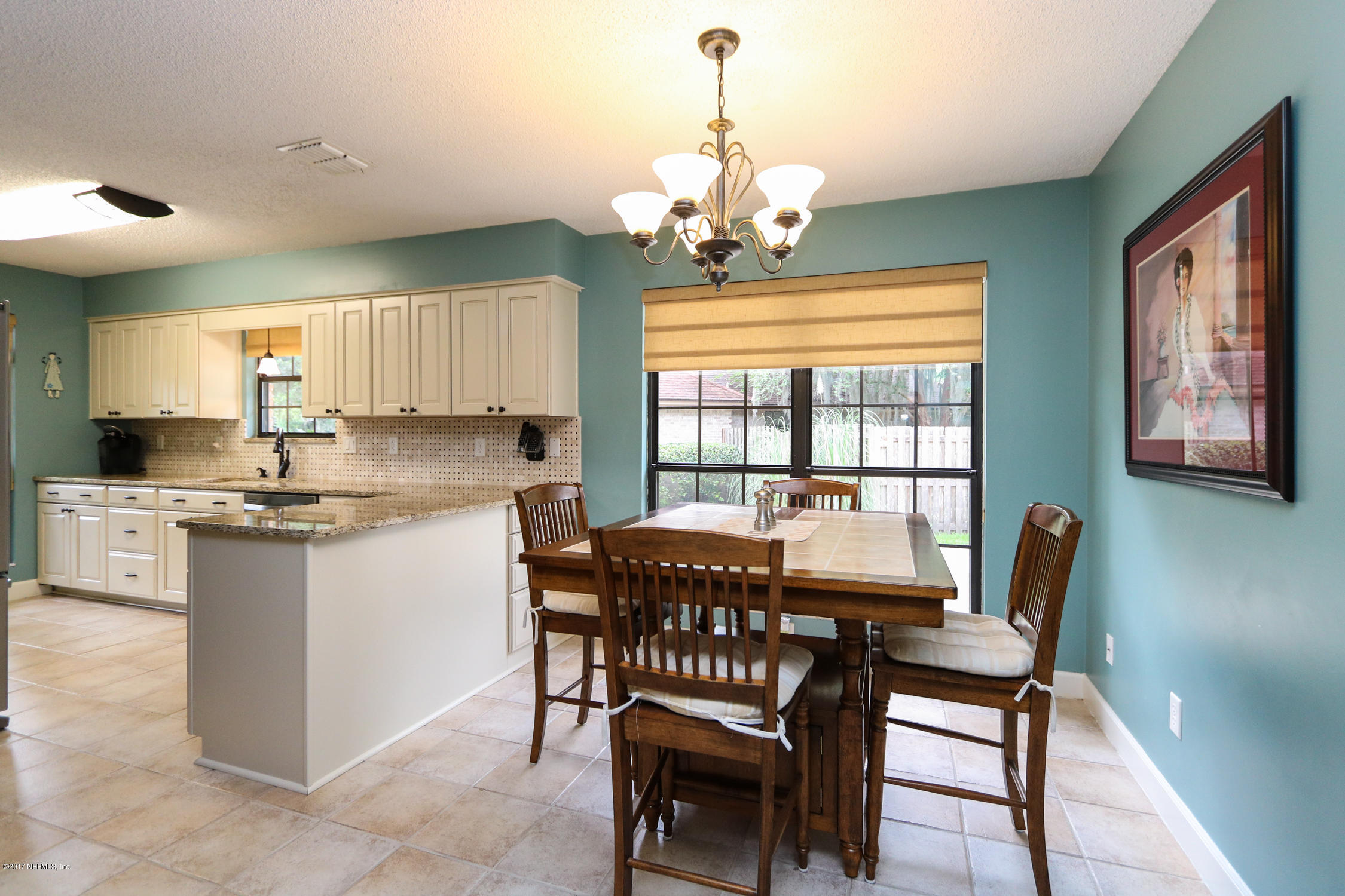 3141 Nautilus Road Middleburg, FL 32068 - Photo 16 of 43 a view of a dining room with furniture window and outside view