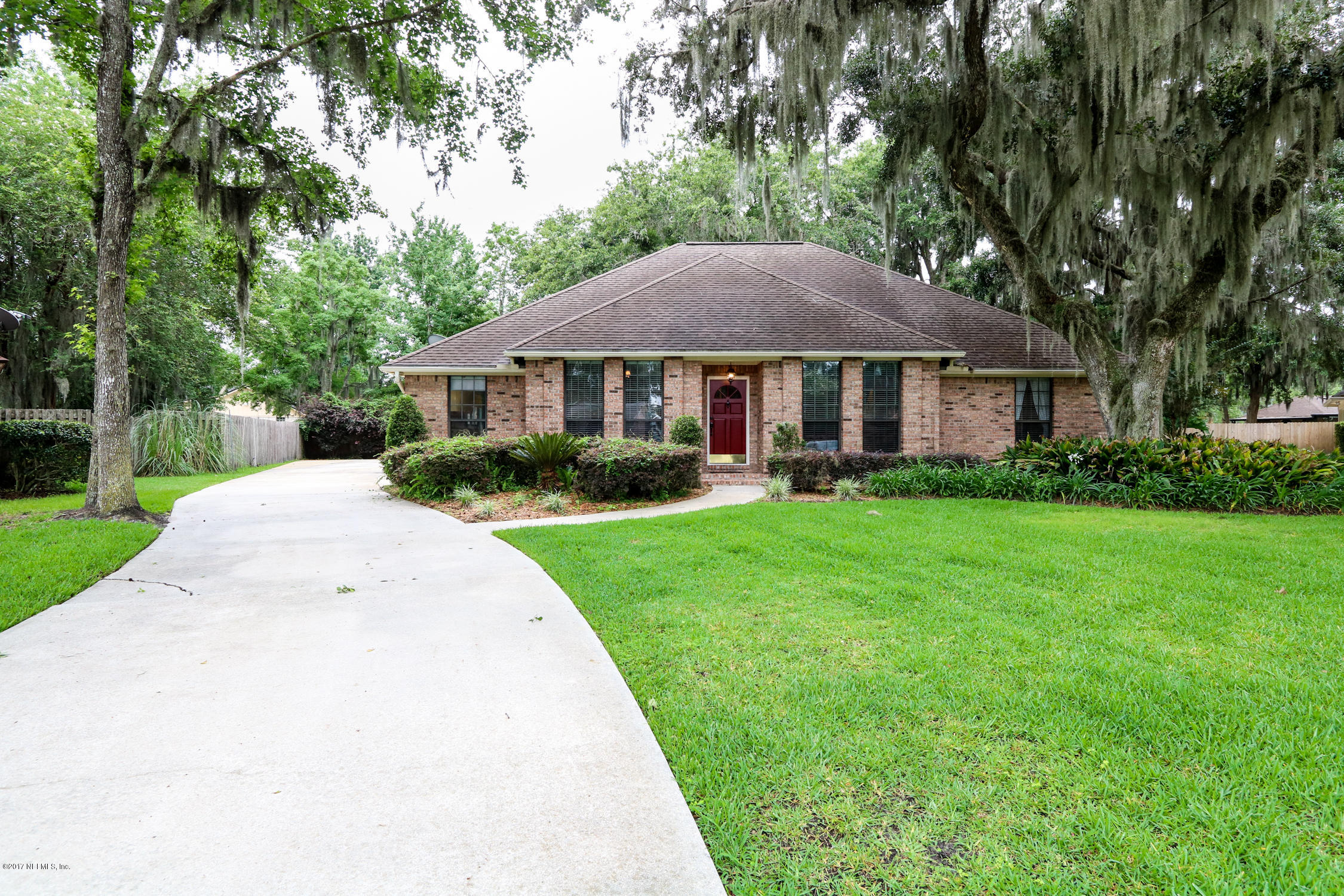3141 Nautilus Road Middleburg, FL 32068 - Photo 2 of 43 a front view of a house with a yard