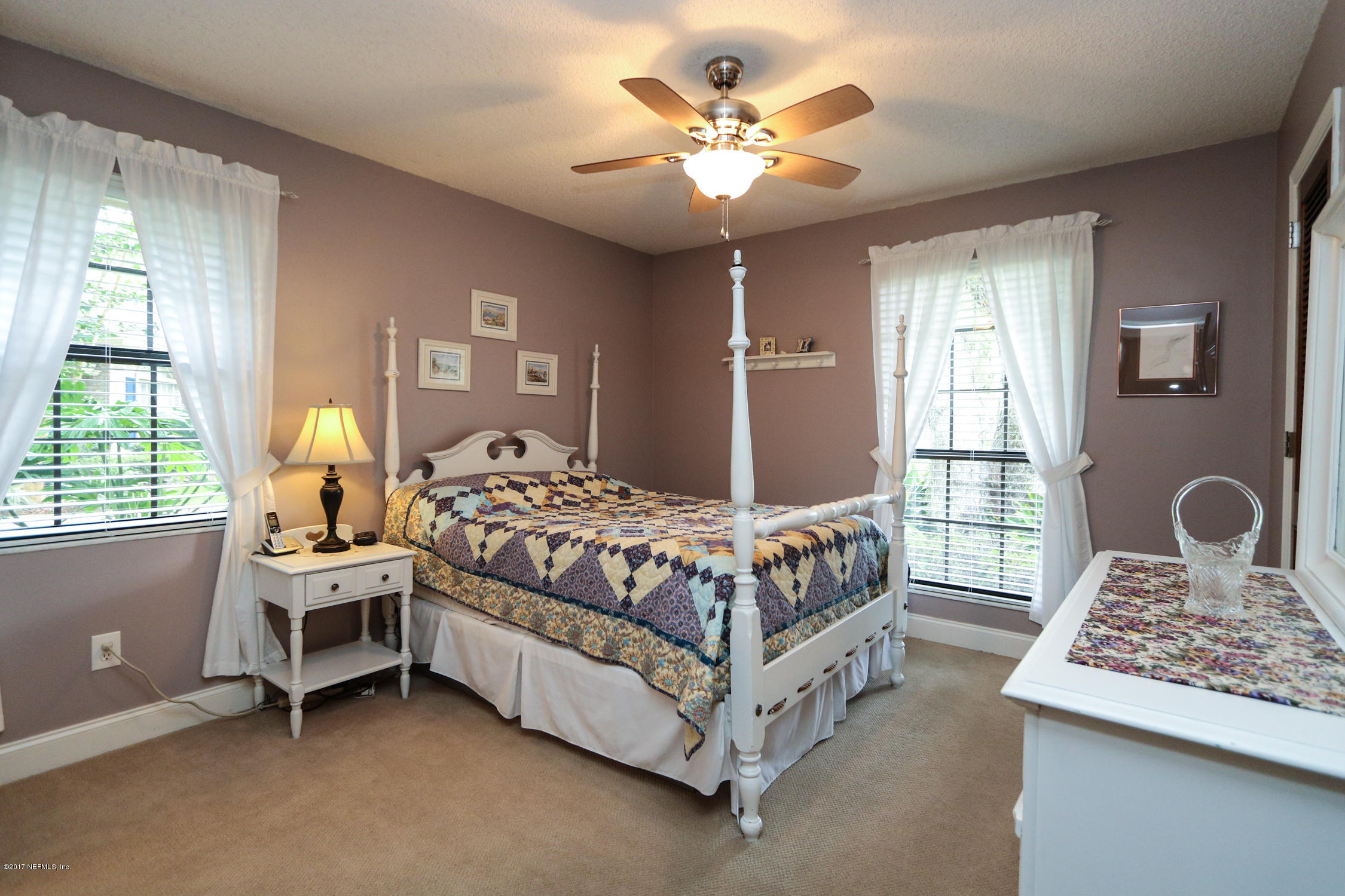 3141 Nautilus Road Middleburg, FL 32068 - Photo 28 of 43 a bedroom with a bed and a table