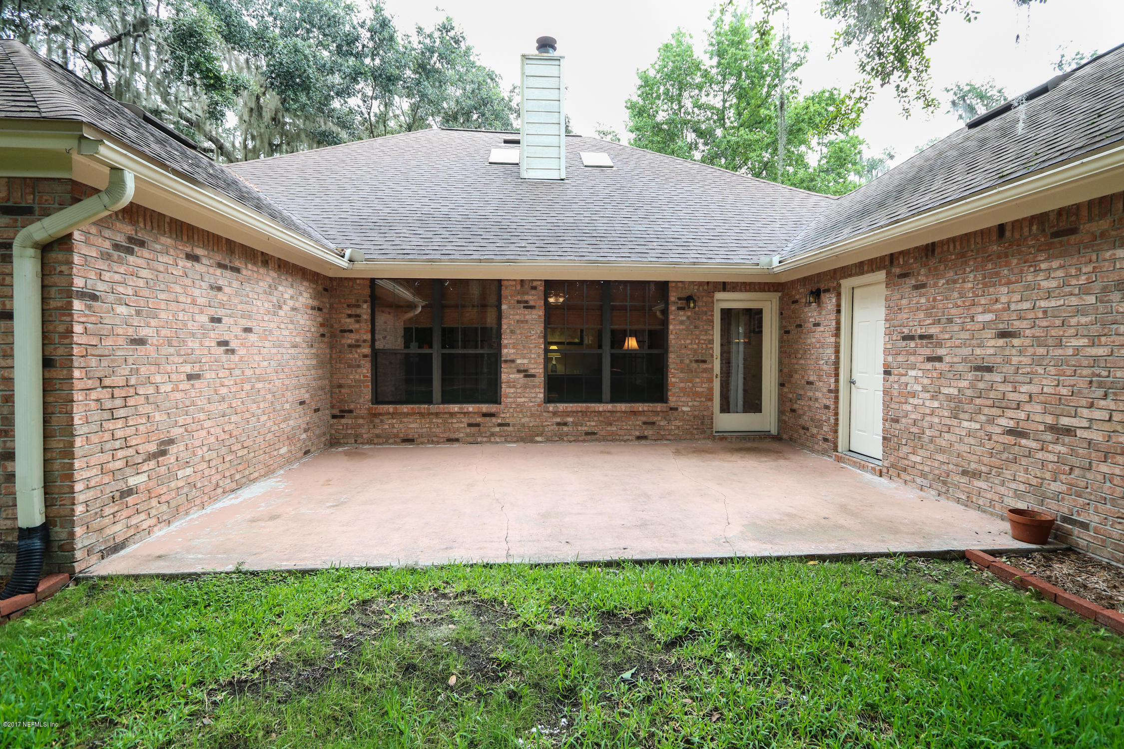 3141 Nautilus Road Middleburg, FL 32068 - Photo 35 of 43 a backyard of a house with lots of green space