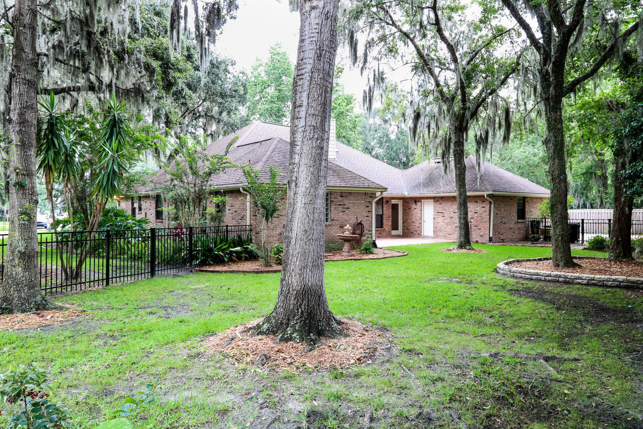 3141 Nautilus Road Middleburg, FL 32068 - Photo 39 of 43 a front view of a house with garden