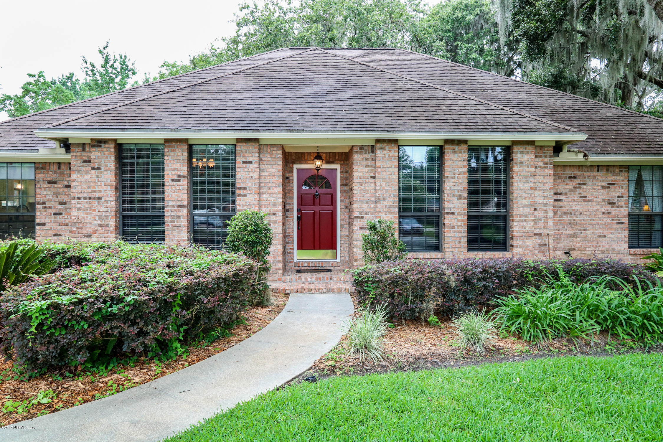 3141 Nautilus Road Middleburg, FL 32068 - Photo 4 of 43 a front view of a house with garden