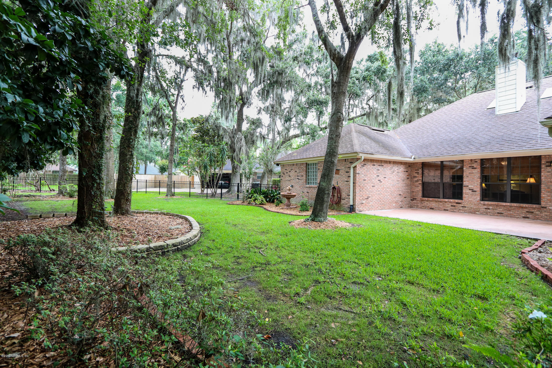 3141 Nautilus Road Middleburg, FL 32068 - Photo 41 of 43 a front view of a house with garden
