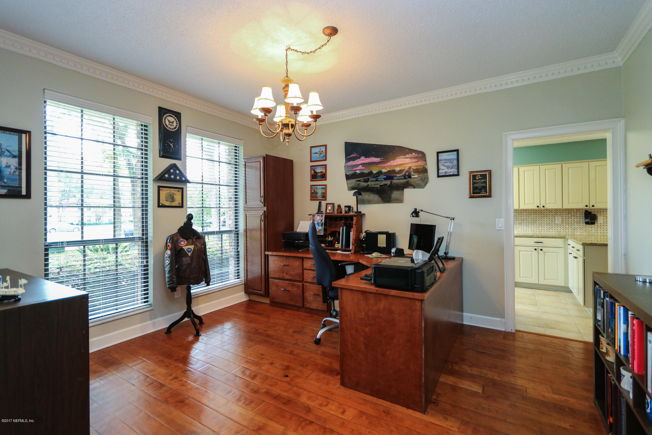 3141 Nautilus Road Middleburg, FL 32068 - Photo 10 of 43 a view of a livingroom with kitchen and furniture