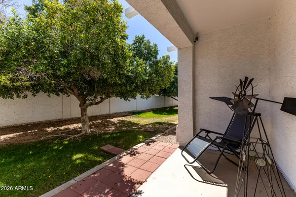 a view of a swimming pool with outdoor seating