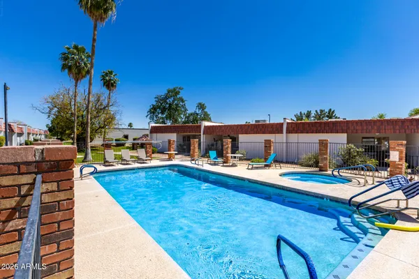 a view of a swimming pool with a lounge chairs
