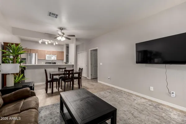 a view of a livingroom with furniture and a flat screen tv
