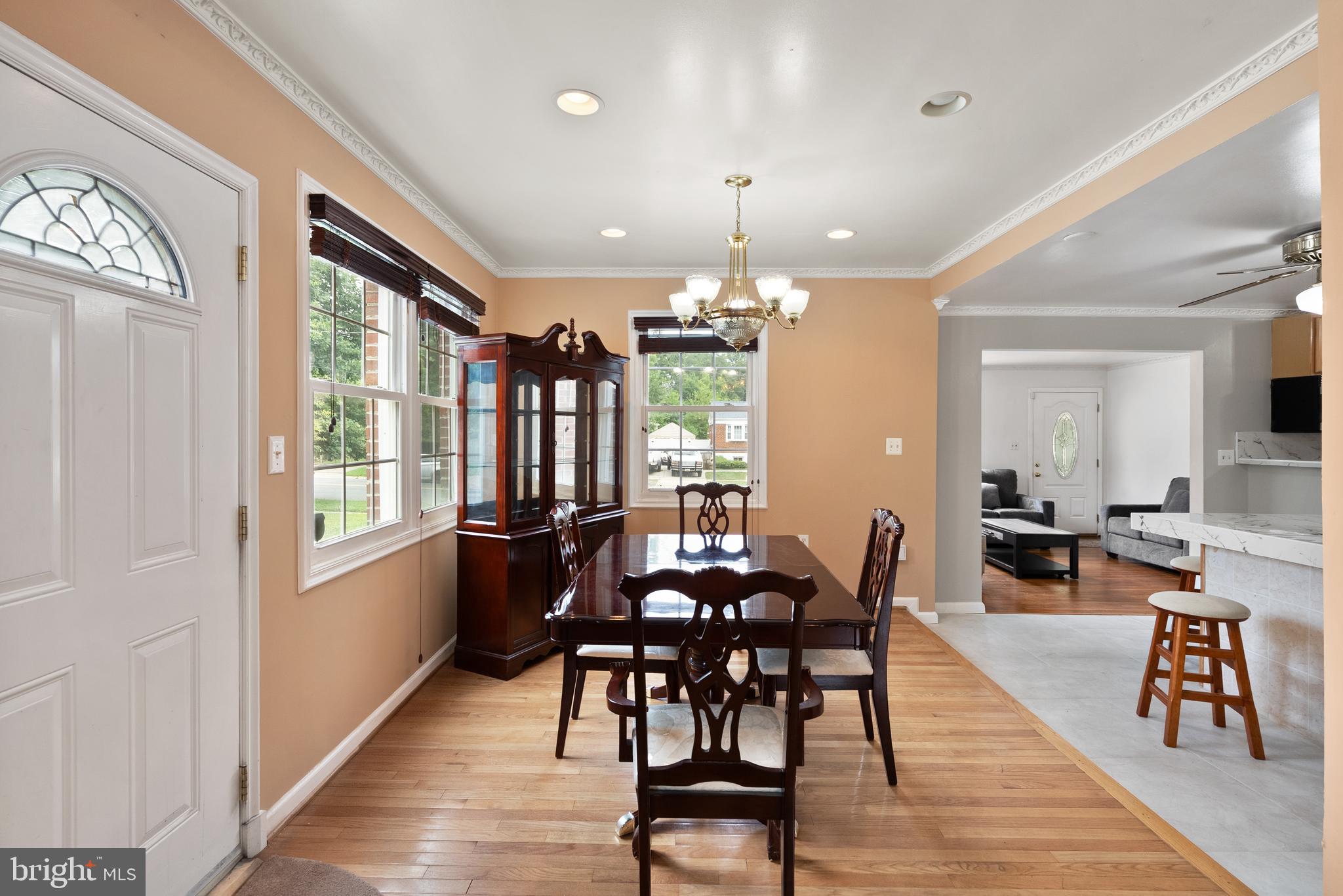 11300 Schuylkill Road Rockville, MD 20852 - Photo 13 of 55 a view of a dining room with furniture window and wooden floor