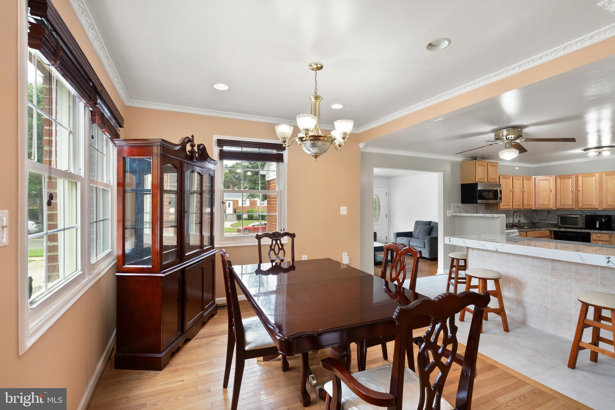 11300 Schuylkill Road Rockville, MD 20852 - Photo 14 of 55 a view of a dining room with furniture window and wooden floor