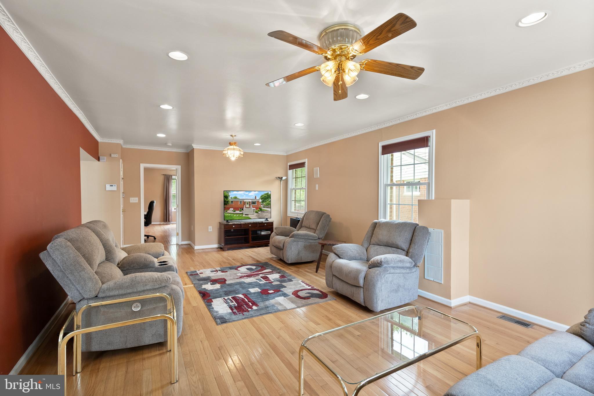 11300 Schuylkill Road Rockville, MD 20852 - Photo 19 of 55 a living room with furniture and a chandelier