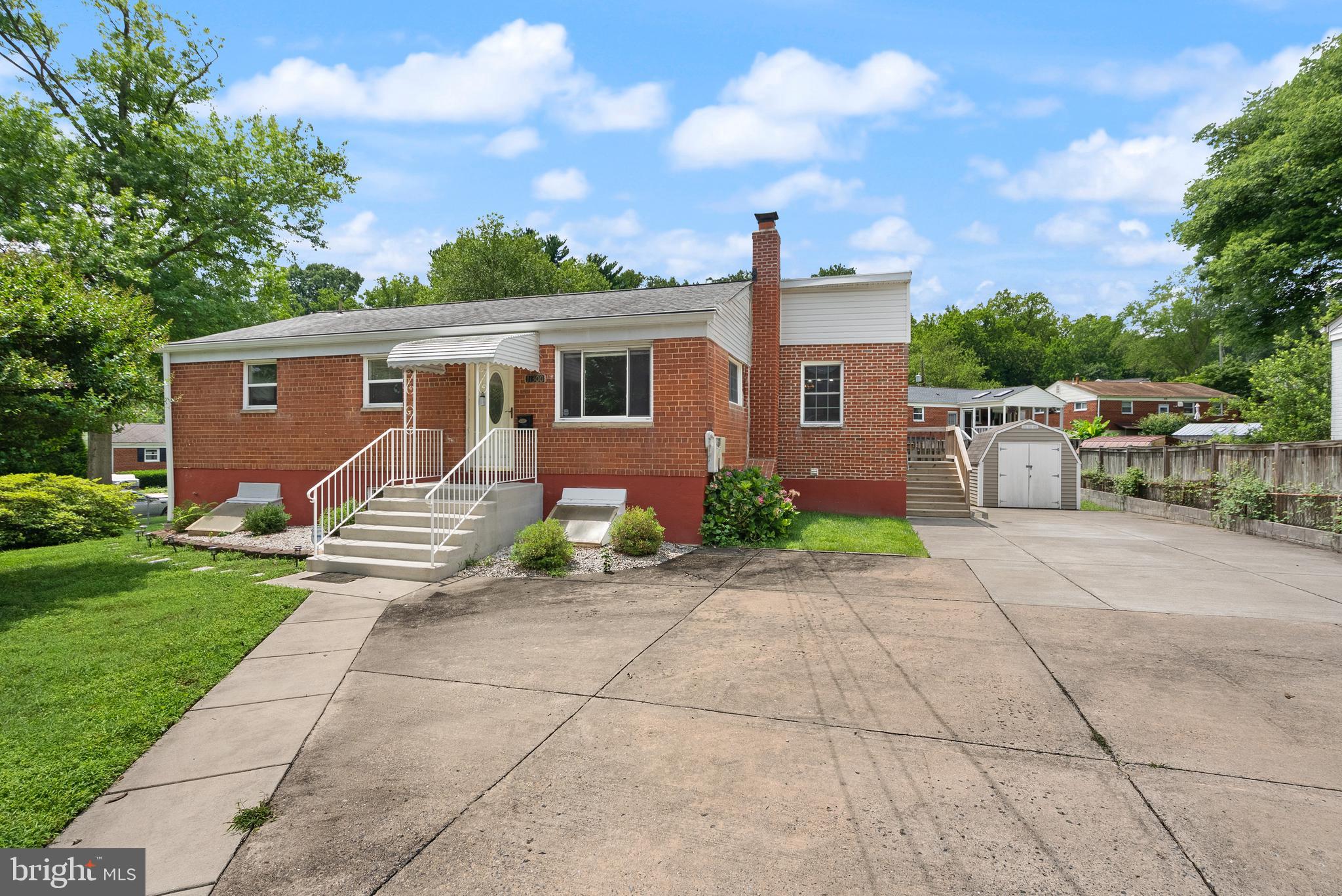 11300 Schuylkill Road Rockville, MD 20852 - Photo 2 of 55 a front view of house with yard and green space