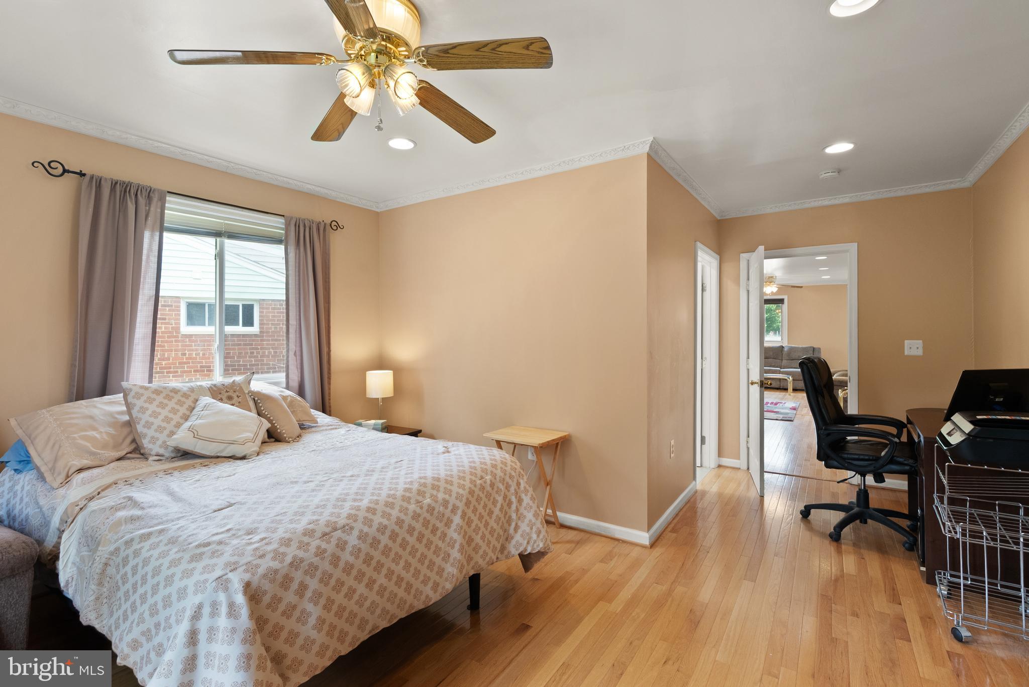 11300 Schuylkill Road Rockville, MD 20852 - Photo 21 of 55 a bedroom with a bed and wooden floor