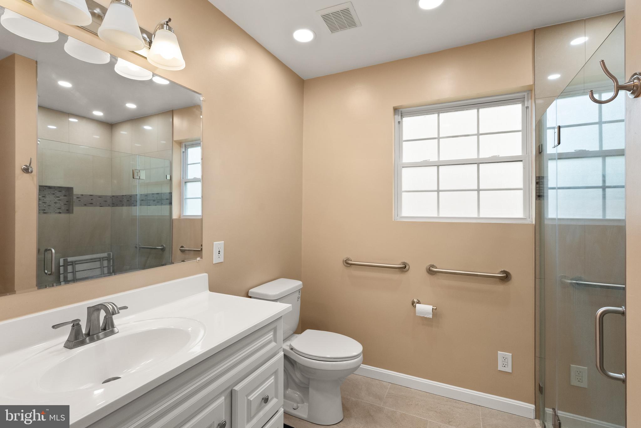 11300 Schuylkill Road Rockville, MD 20852 - Photo 24 of 55 a bathroom with a sink toilet and shower