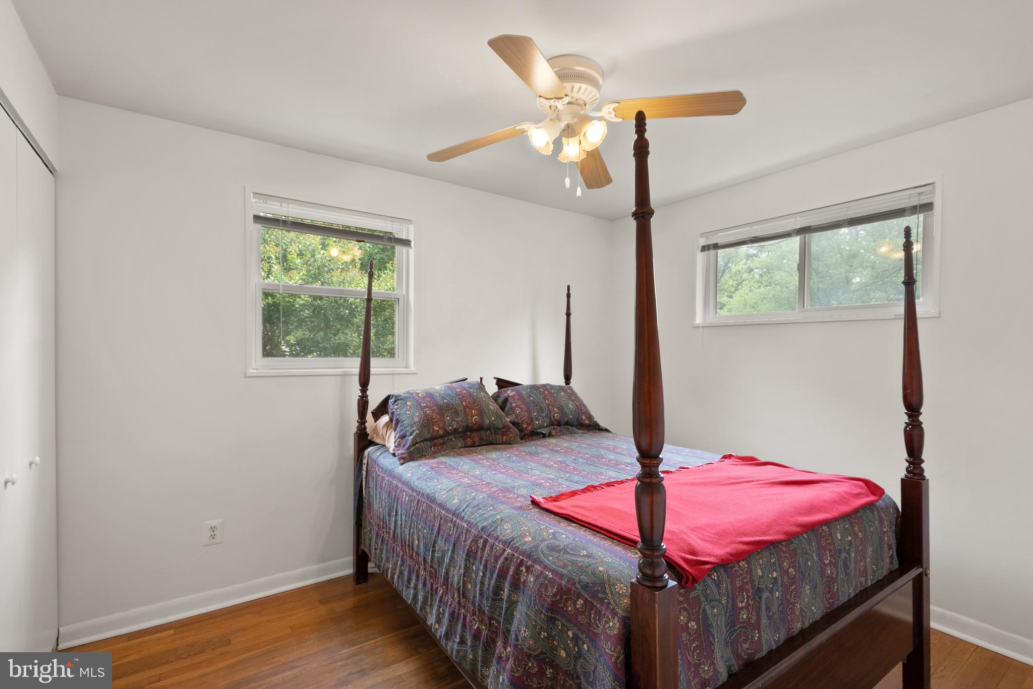 11300 Schuylkill Road Rockville, MD 20852 - Photo 27 of 55 a bedroom with a bed and a chandelier