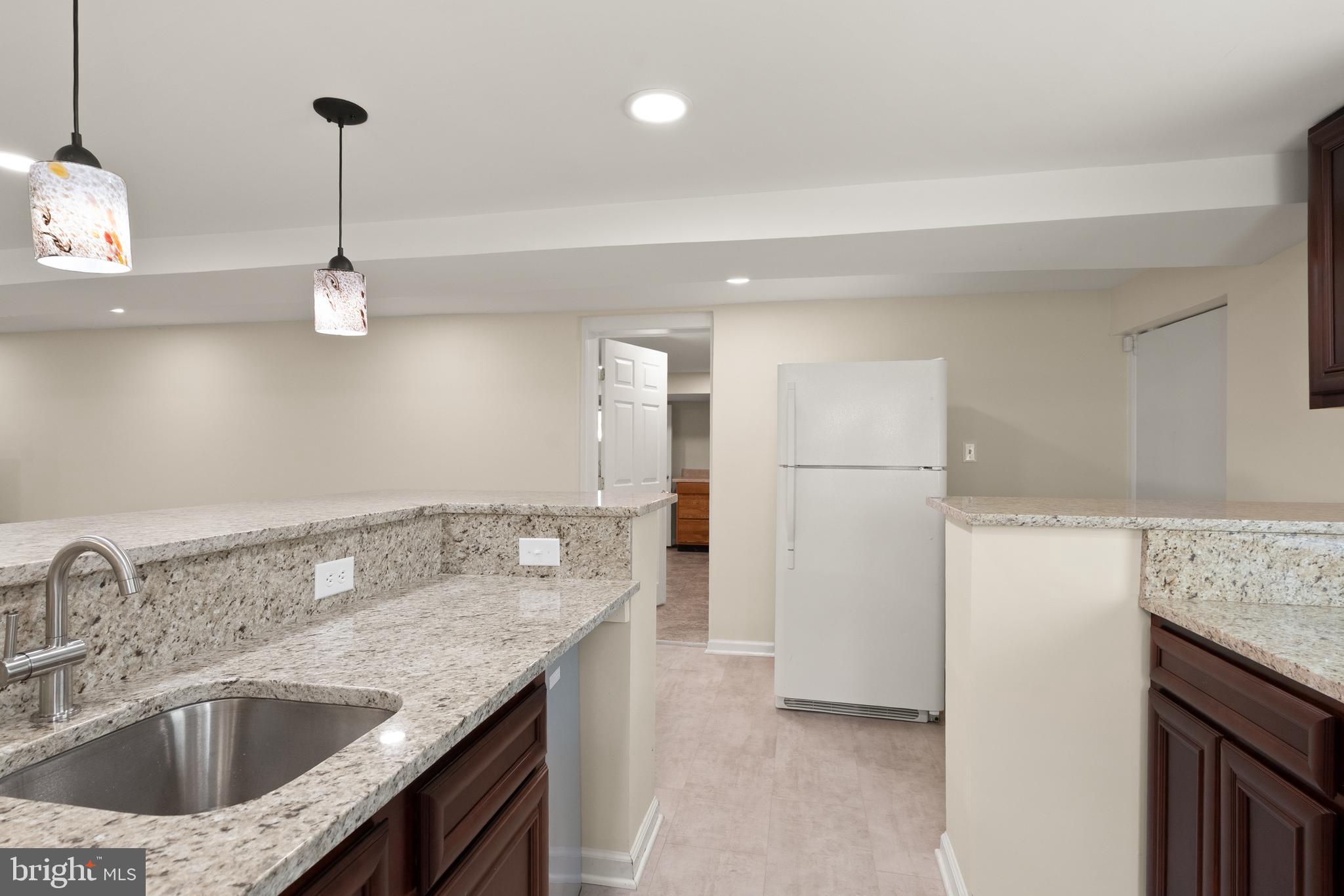 11300 Schuylkill Road Rockville, MD 20852 - Photo 34 of 55 a kitchen with stainless steel appliances granite countertop a sink refrigerator and cabinets