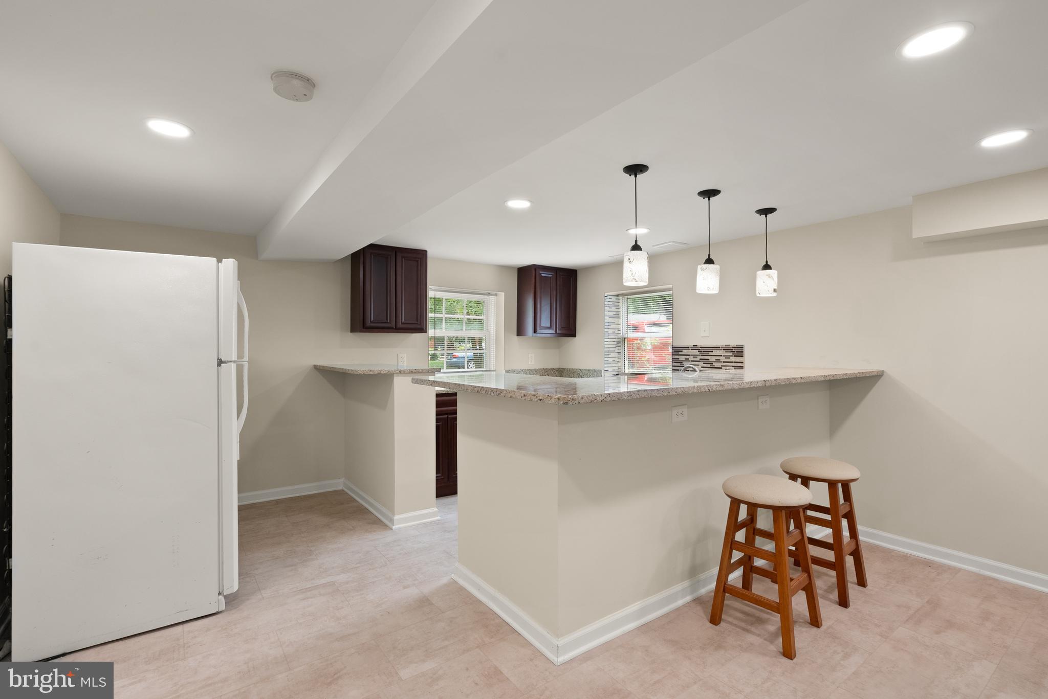 11300 Schuylkill Road Rockville, MD 20852 - Photo 36 of 55 a kitchen with stainless steel appliances granite countertop a refrigerator and a stove top oven