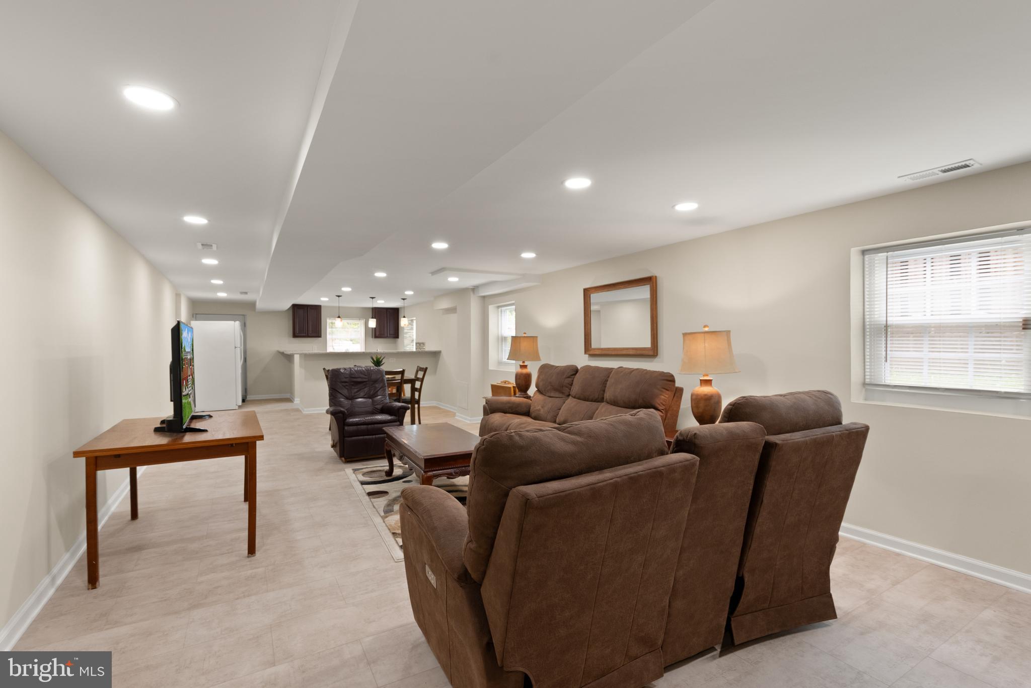 11300 Schuylkill Road Rockville, MD 20852 - Photo 39 of 55 a living room with furniture a ceiling fan and a window