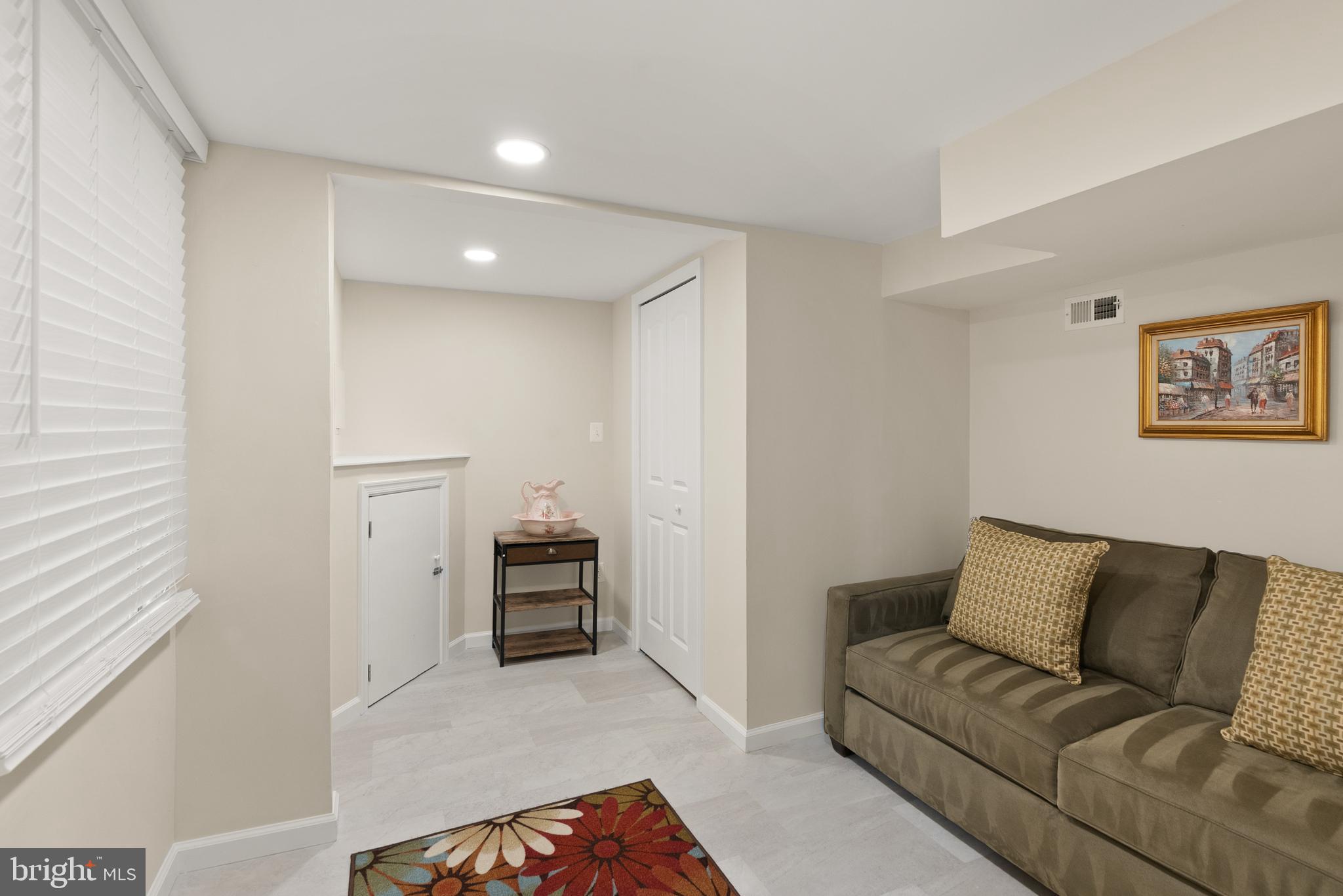 11300 Schuylkill Road Rockville, MD 20852 - Photo 41 of 55 a living room with furniture and a walk in closet