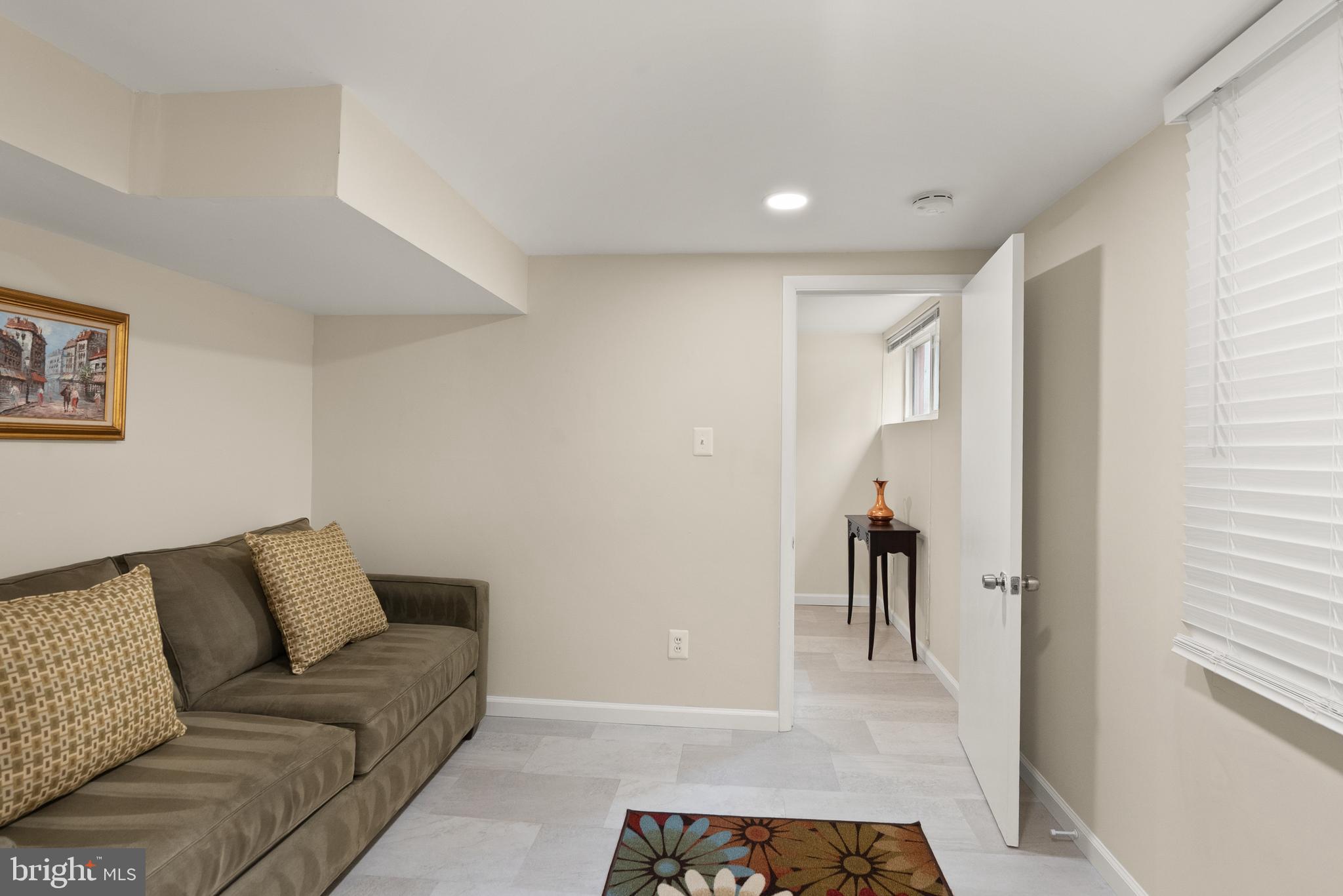 11300 Schuylkill Road Rockville, MD 20852 - Photo 42 of 55 a living room with furniture and a rug