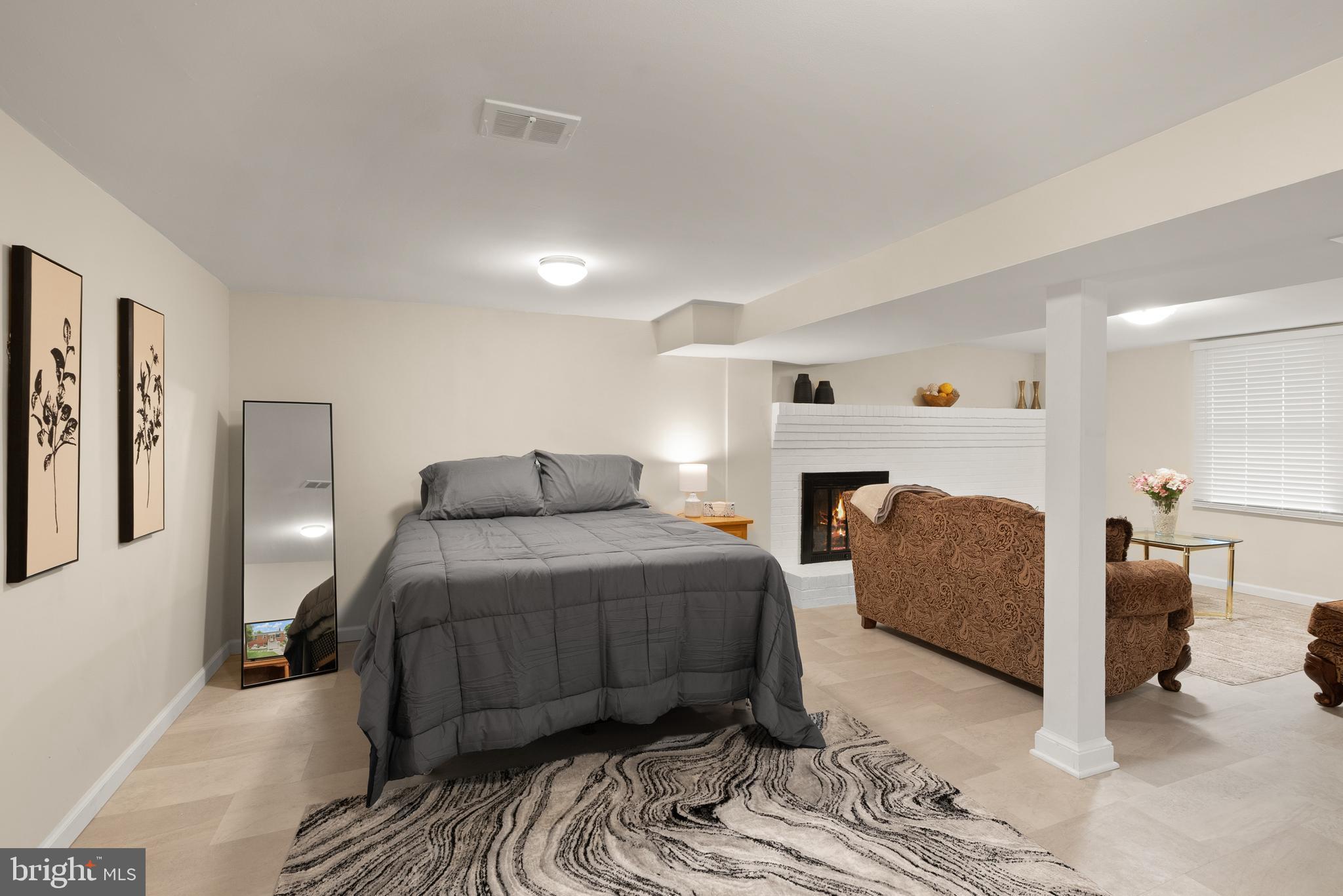 11300 Schuylkill Road Rockville, MD 20852 - Photo 43 of 55 a bedroom with a bed and a couch