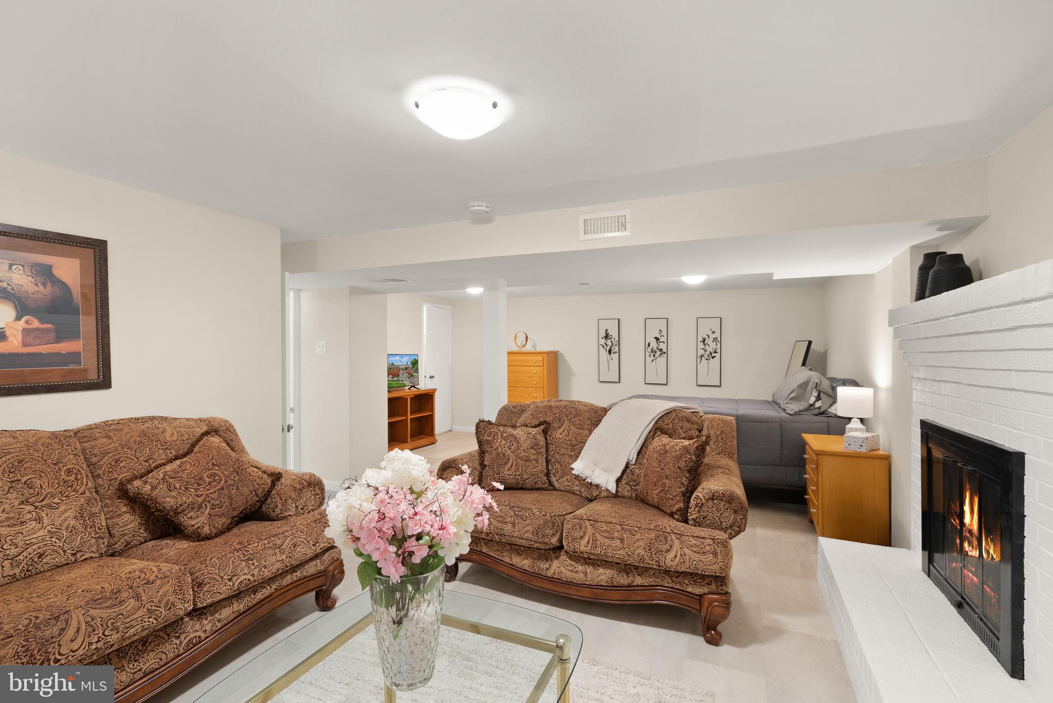 11300 Schuylkill Road Rockville, MD 20852 - Photo 45 of 55 a living room with furniture and a fireplace