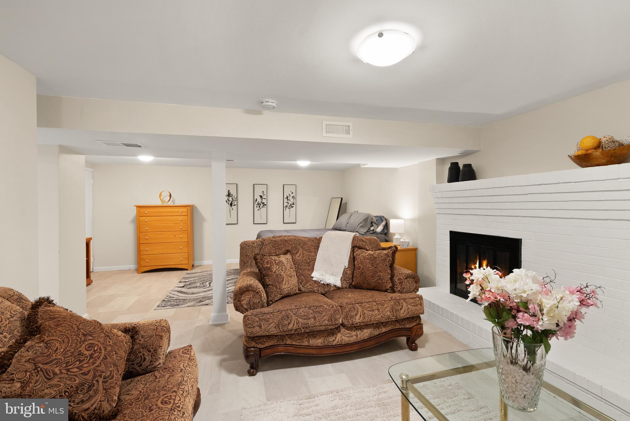11300 Schuylkill Road Rockville, MD 20852 - Photo 46 of 55 a living room with furniture and a fireplace
