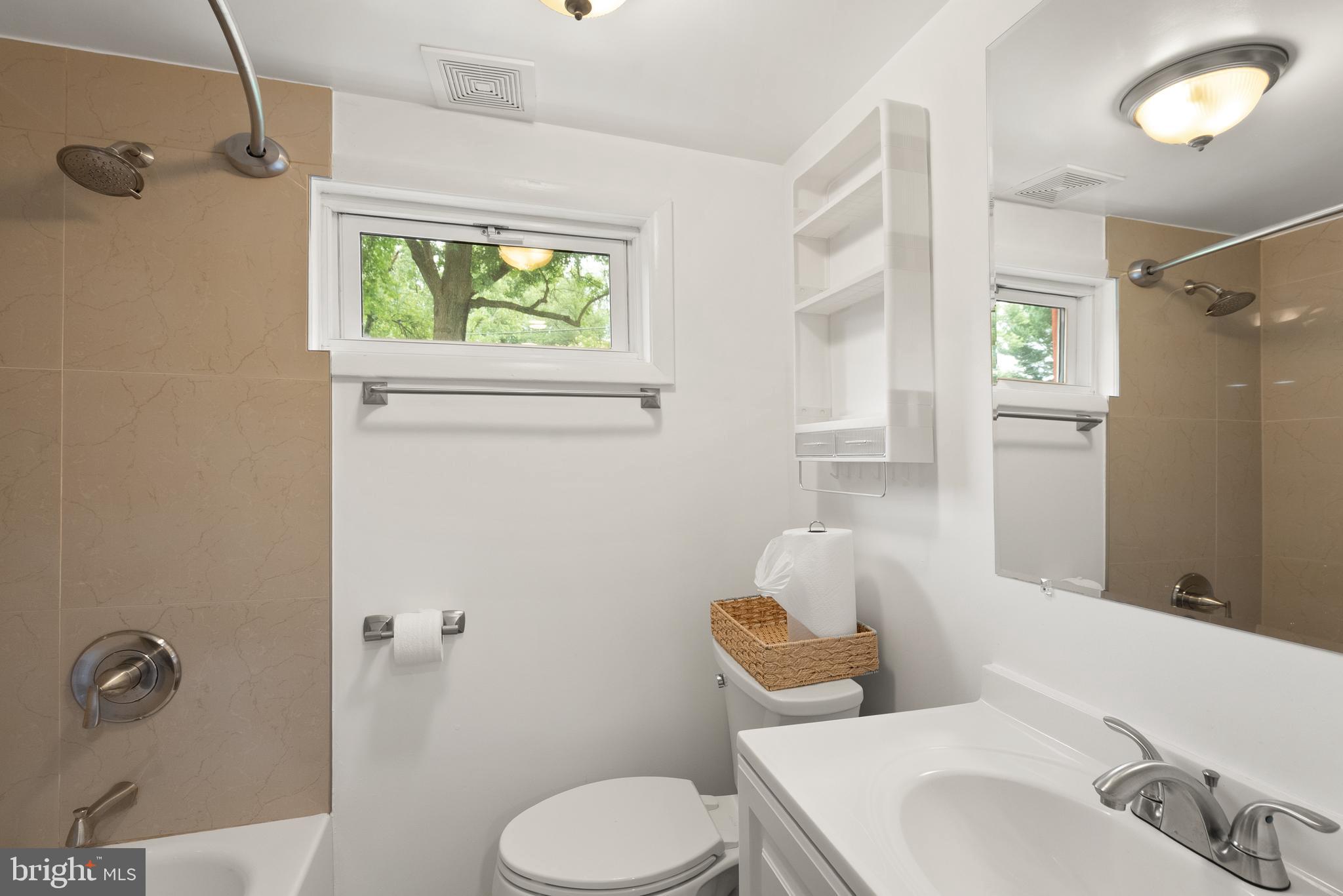 11300 Schuylkill Road Rockville, MD 20852 - Photo 47 of 55 a bathroom with a sink toilet and shower