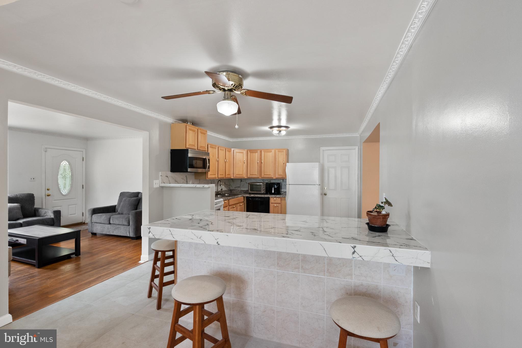11300 Schuylkill Road Rockville, MD 20852 - Photo 6 of 55 a large kitchen with a table and chairs
