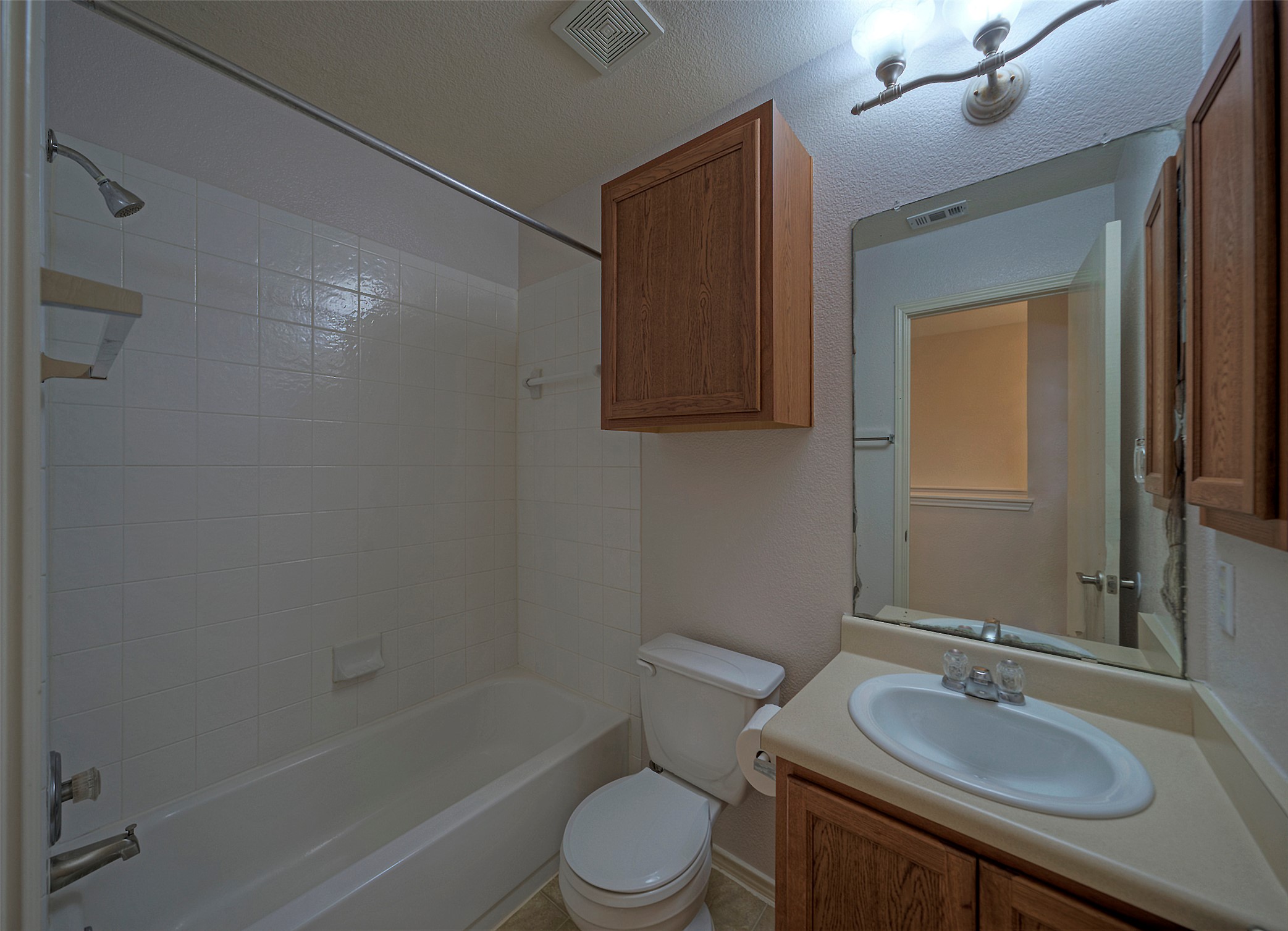 18100 Belfry Pass Manor, TX 78653 - Photo 21 of 30 a bathroom with a sink toilet and shower