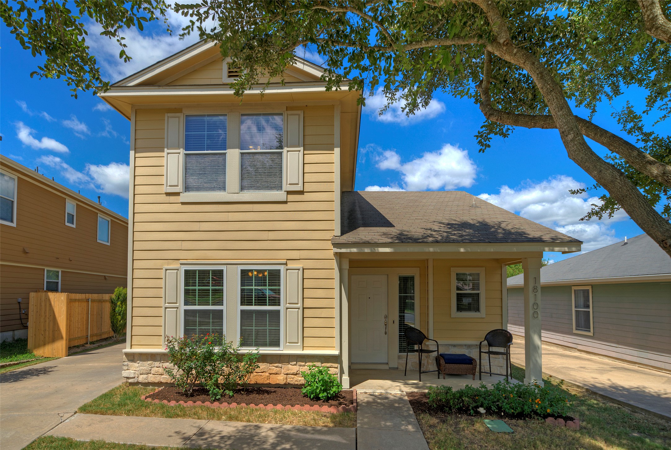 18100 Belfry Pass Manor, TX 78653 - Photo 29 of 30 a front view of a house with garden