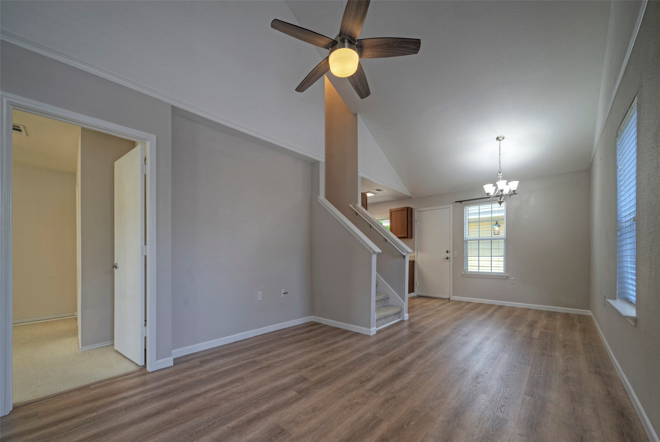 18100 Belfry Pass Manor, TX 78653 - Photo 6 of 30 a view of an empty room with wooden floor and a window
