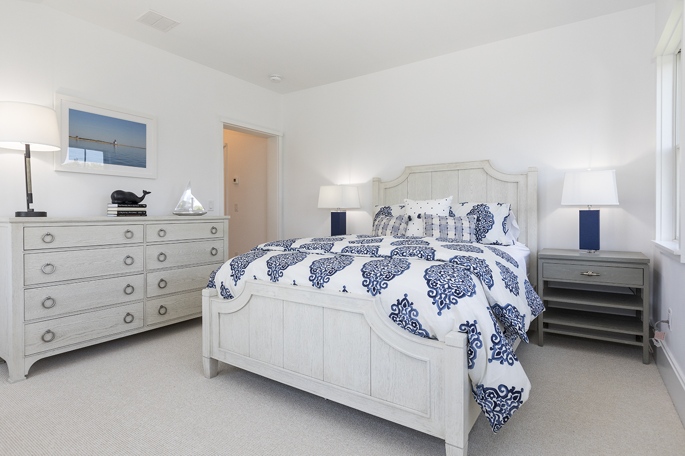 12 Wood Lily Road Nantucket, MA 02554 - Photo 42 of 70 a bed room with a bed and a night stand