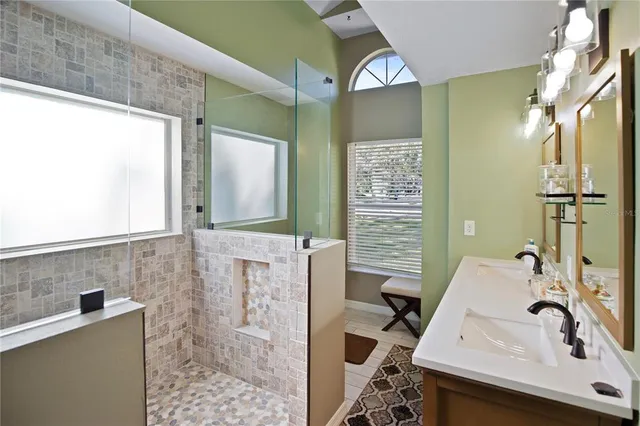 a bathroom with a double vanity sink mirror and double