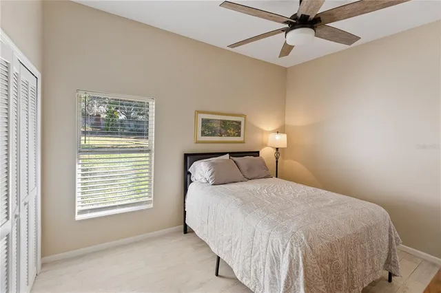 a bedroom with a bed and a night stand