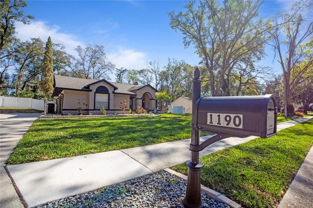a view of a patio with couches and potted plants