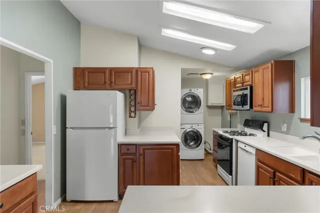 a kitchen with a refrigerator a sink and dishwasher
