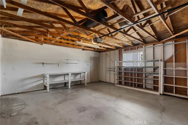 a view of a room with wooden shelves
