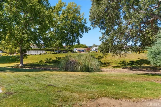 a view of a lake with a yard