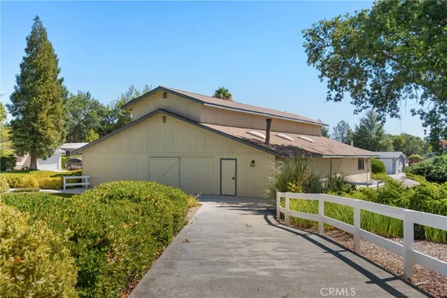 a backyard of a house with yard and outdoor seating