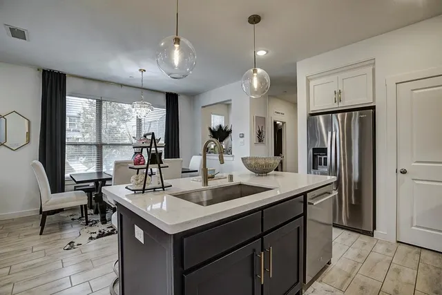 a kitchen with a sink stove and microwave
