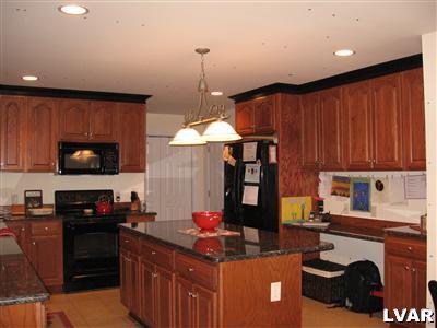 2 Long Mountain Road Effort, PA 18330 - Photo 3 of 12 a kitchen with a stove a refrigerator and a sink