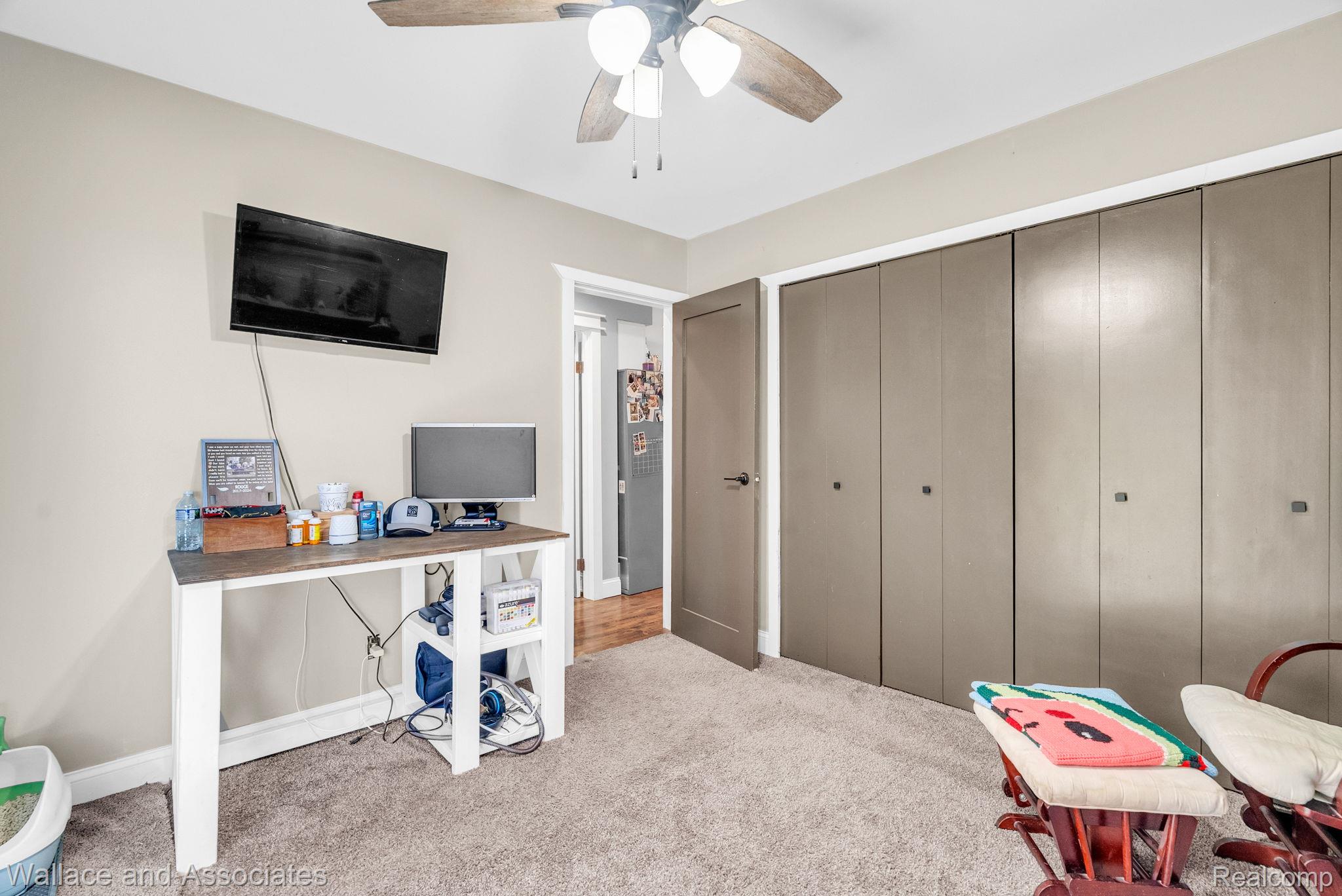 6616 Wellman Line Road Croswell, MI 48422 - Photo 27 of 47 Home office featuring light carpet and ceiling fan