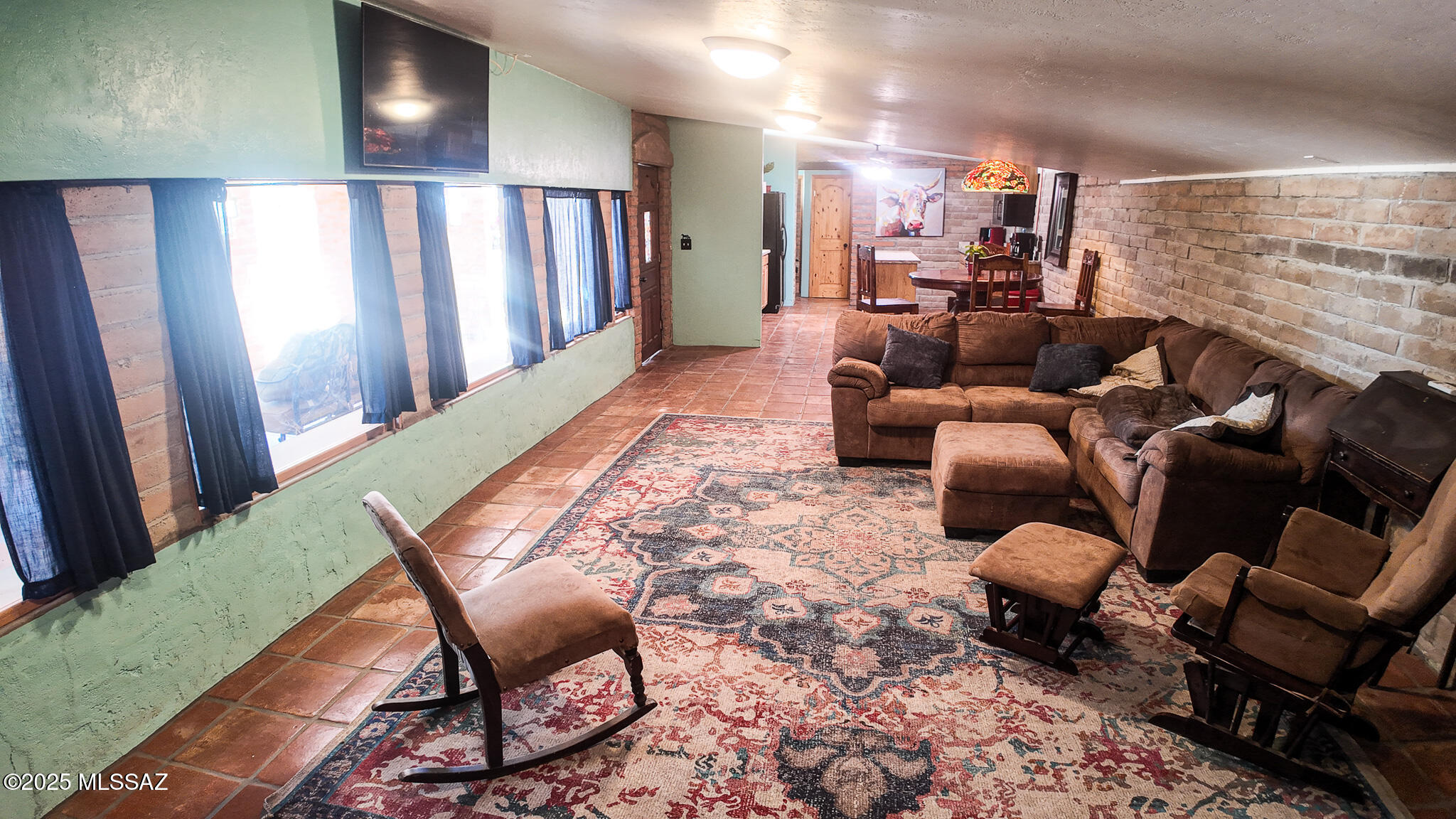 1094 North Pomerene Road Benson, AZ 85602 - Photo 6 of 48 a living room with furniture and a rug