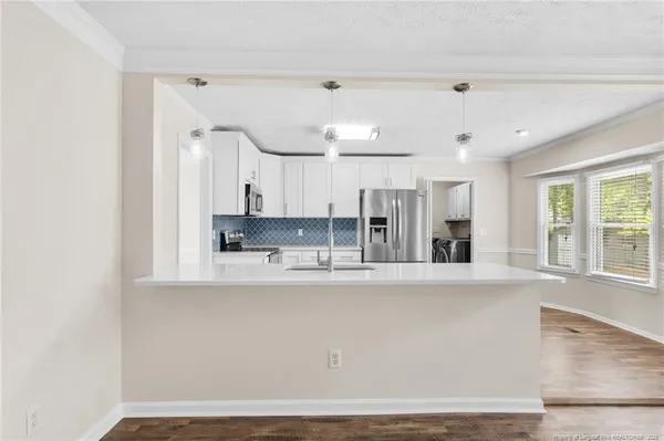 a view of a kitchen with granite countertop cabinets and a sink