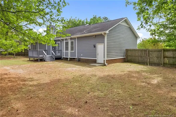 a view of a house with a yard and garage